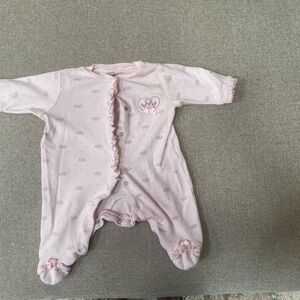 Onesie newborn. Light stain upper left. You can bearly see it.